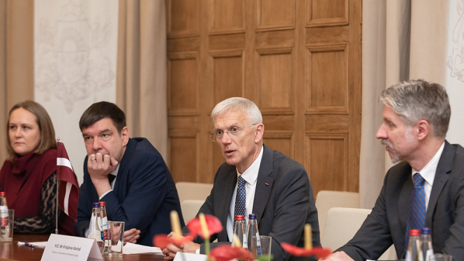 K.Kariņš un NOR