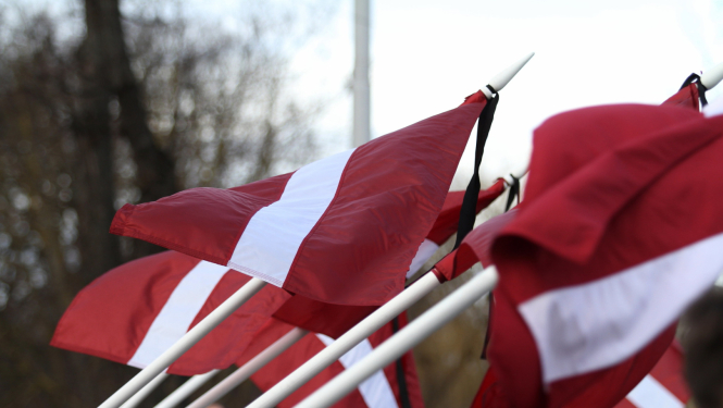 Latvian flags with mourning ribbon