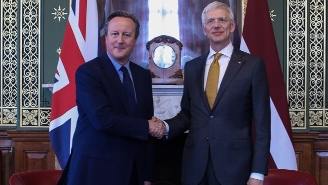 K.Kariņš un D.Kamerons