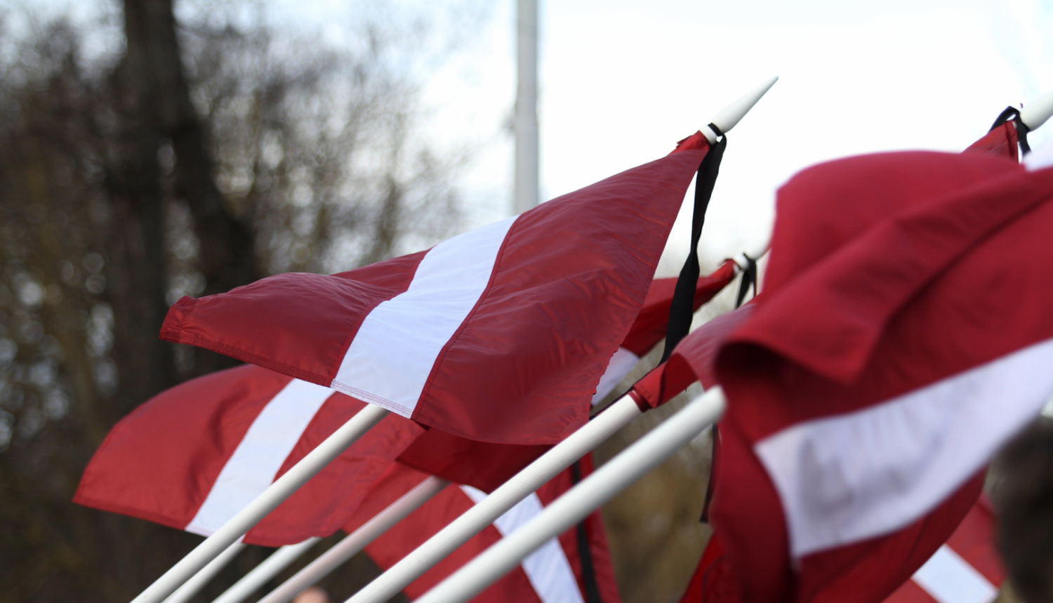Latvian flags with mourning ribbon