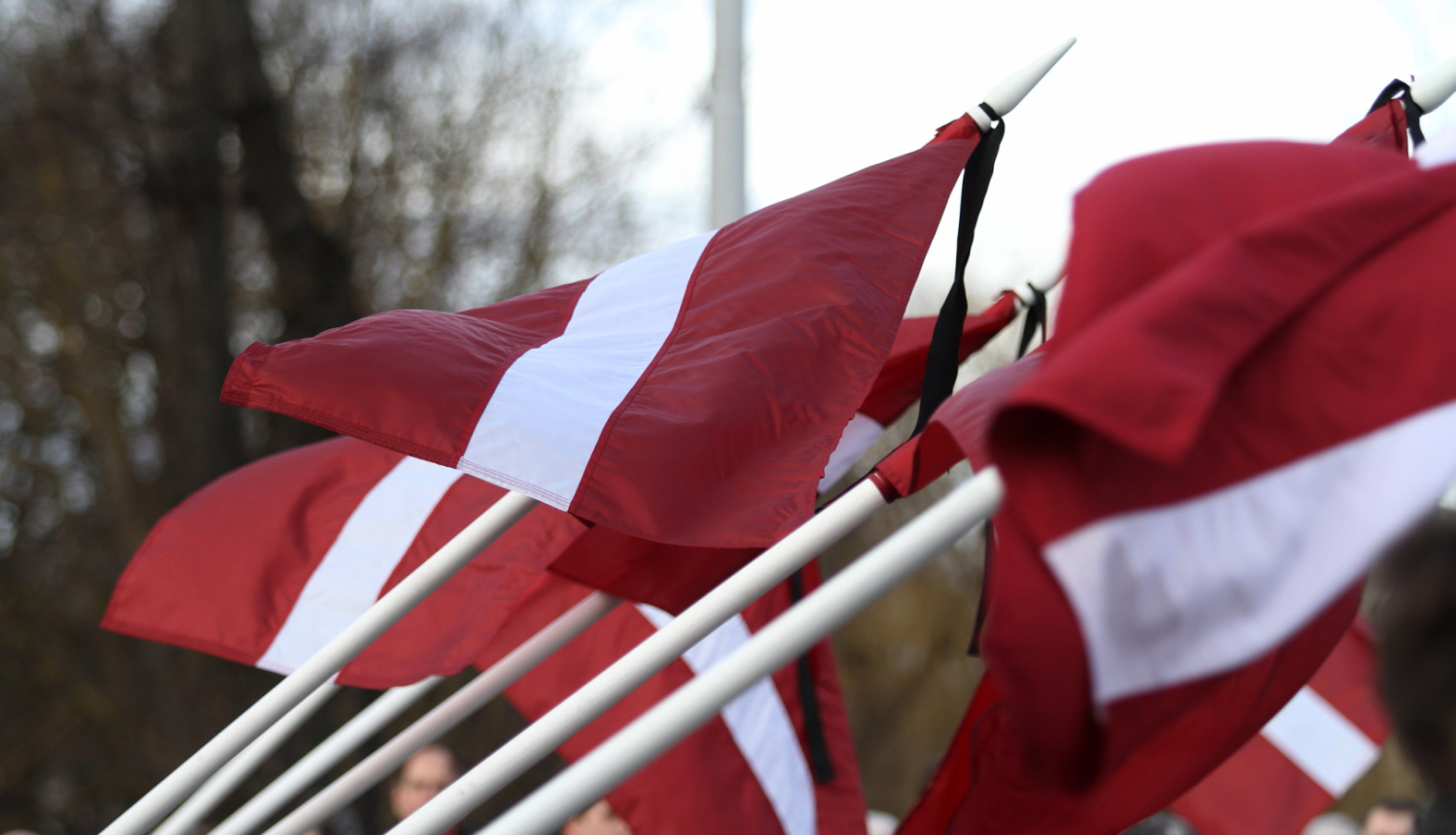 Latvian flags with mourning ribbon