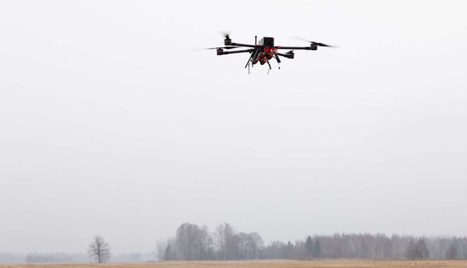 A drone flies over a field